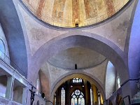 It's a confused Cathédrale- Gothic style on a Romanesque base in the apse. Byzantine syle domes in the nave. Gothic cloister added in the 1500s.