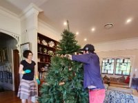 Meanwhile in Brisbane, Nick (who was still renting downstairs and mother Elizabeth and Graham's) helped set up the Christmas tree.