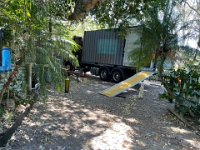 The second truck arrived. Two half-shipping containers headed off to the Kent warehouse until a forwarding address was purchased