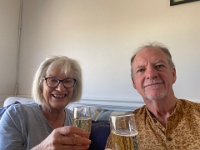 Back at Olivia's apartment where the guys were staying, they toasted Olivia and Cam who were camping near the Murray River.