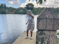 Walking around the lake in the town, Paulie followed the directions of official signage.